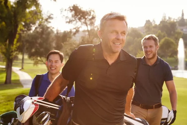 a group of male friends on the golf course